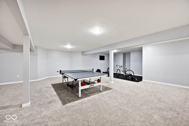 rec room featuring carpet and baseboards