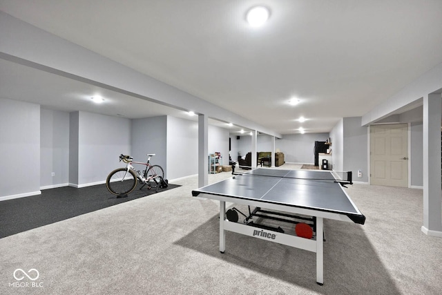 recreation room with carpet flooring and baseboards