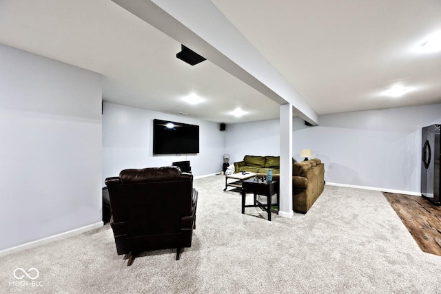 carpeted living room with baseboards