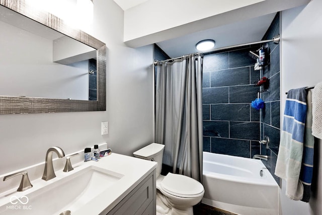 full bath with vanity, shower / bath combo with shower curtain, and toilet