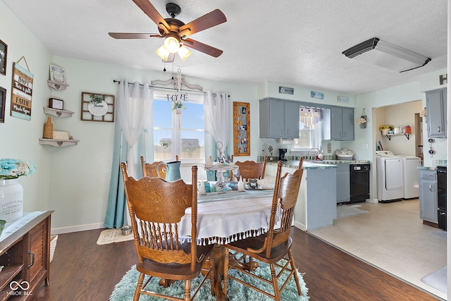 dining area with plenty of natural light, baseboards, separate washer and dryer, and wood finished floors