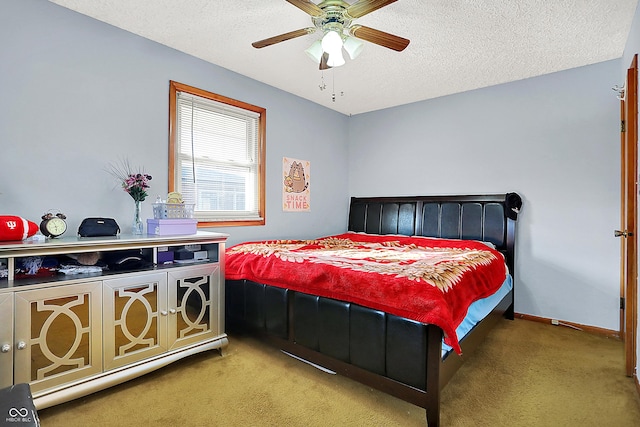 bedroom featuring carpet flooring, a textured ceiling, and baseboards