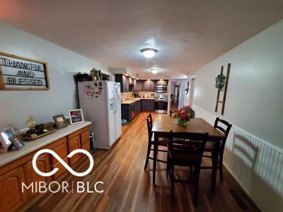 dining space with wood finished floors