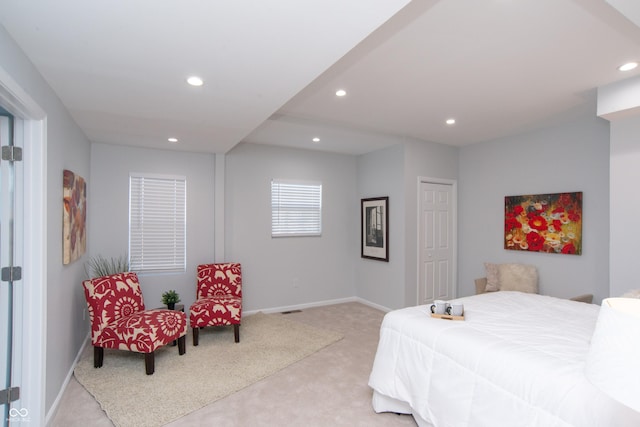 bedroom with light carpet, visible vents, baseboards, and recessed lighting