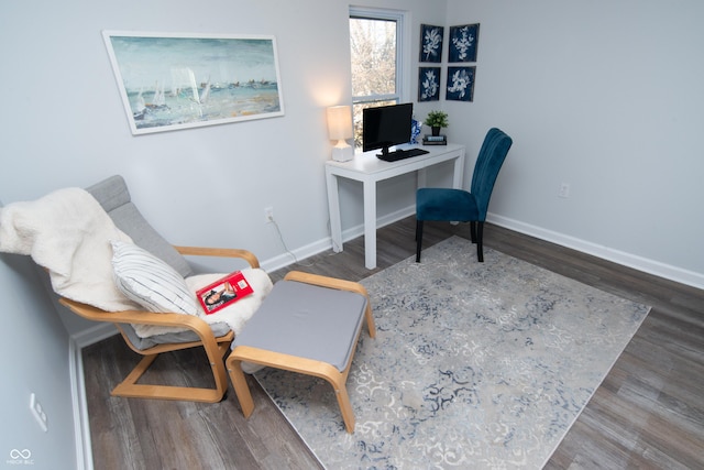 office space featuring wood finished floors and baseboards