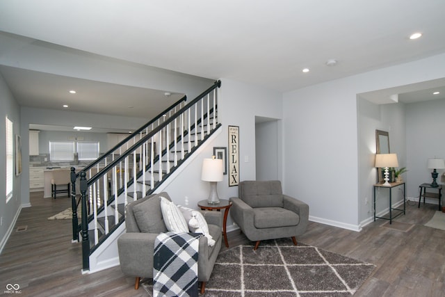 interior space with stairs, recessed lighting, baseboards, and wood finished floors