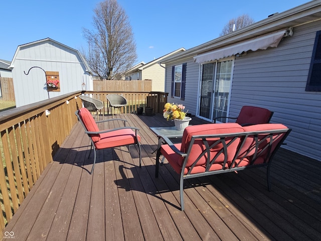 wooden deck featuring outdoor dining space and fence