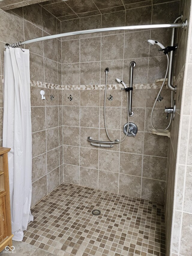 bathroom with tiled shower