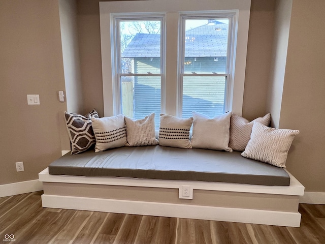 sitting room featuring baseboards and wood finished floors