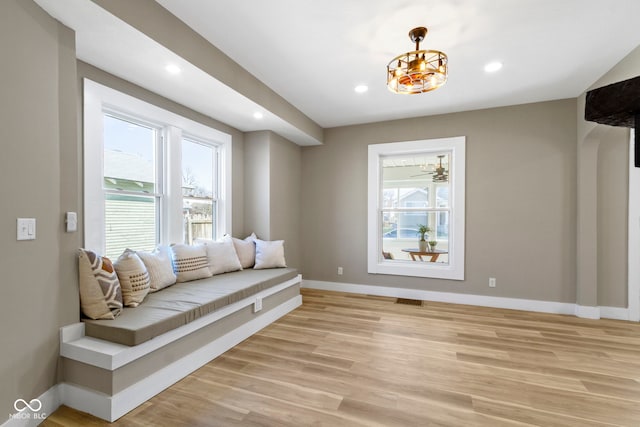 living area with visible vents, recessed lighting, baseboards, and light wood-style floors