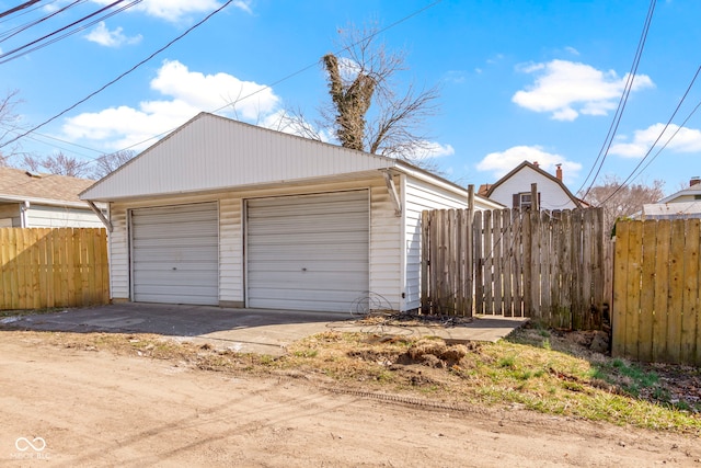 detached garage with fence