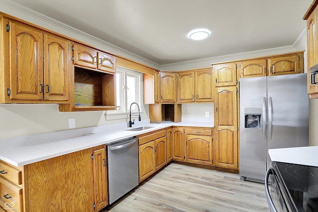 kitchen with stainless steel appliances, brown cabinetry, a sink, and ornamental molding