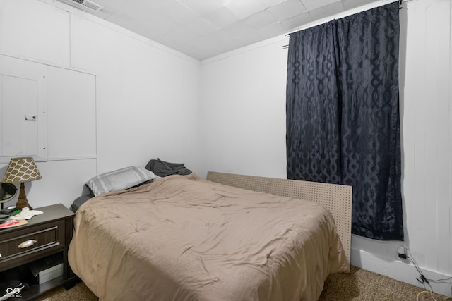 bedroom with crown molding