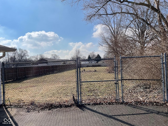 exterior space with fence and a lawn