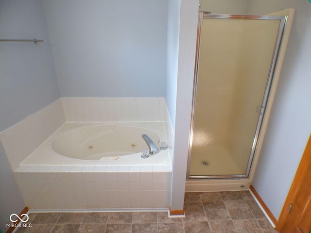 full bath with a shower stall and a tub with jets