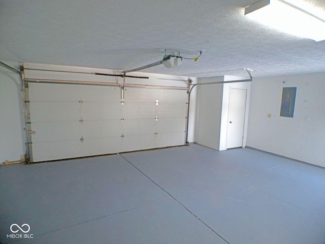 garage with electric panel and a garage door opener