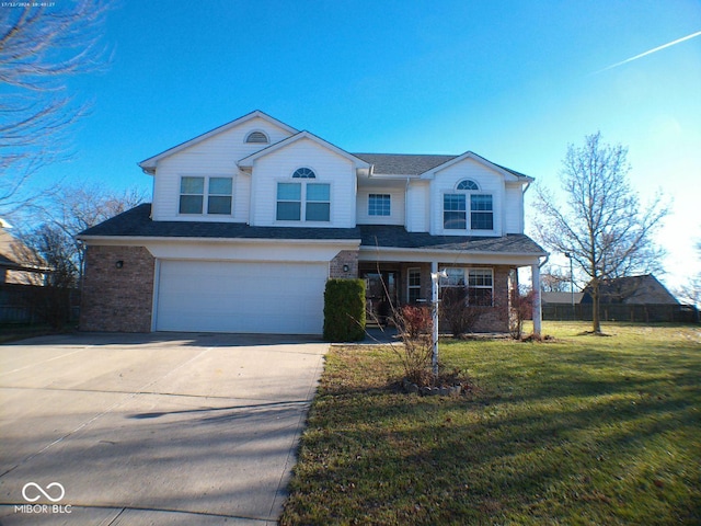 traditional-style home with a front lawn, concrete driveway, brick siding, and an attached garage