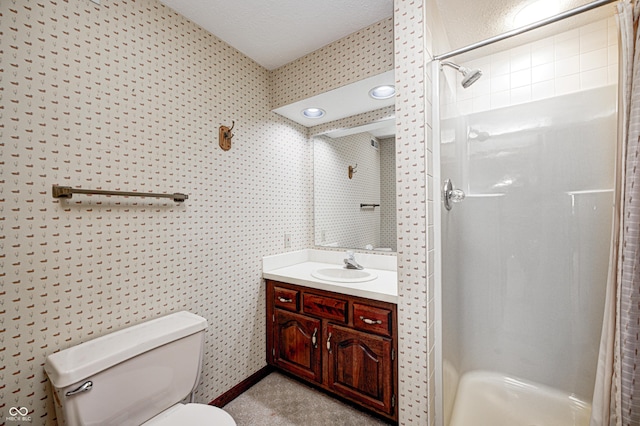 bathroom featuring a shower stall, toilet, and vanity