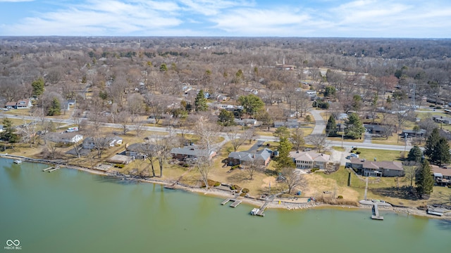 birds eye view of property with a water view and a residential view