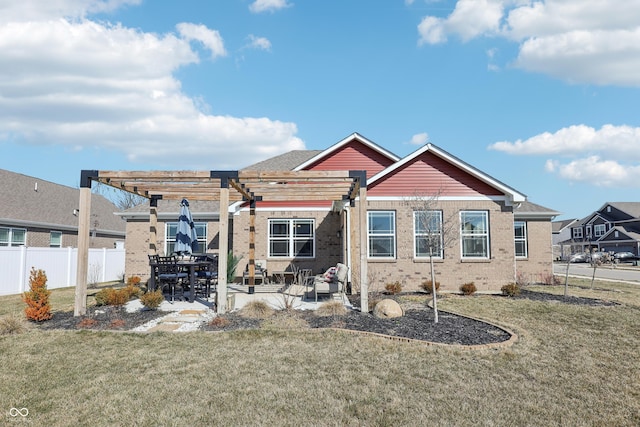 rear view of house featuring a patio area, a pergola, a yard, and fence