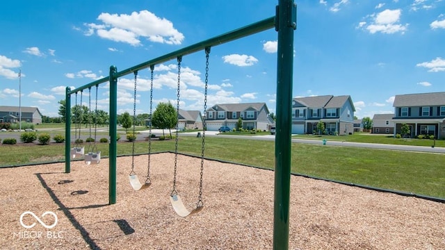 surrounding community with a residential view, a lawn, and playground community