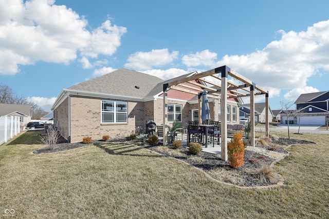 back of house with a patio, fence, a yard, a pergola, and brick siding