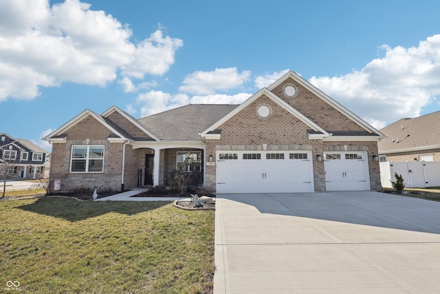 craftsman-style home with brick siding, a front lawn, fence, concrete driveway, and an attached garage