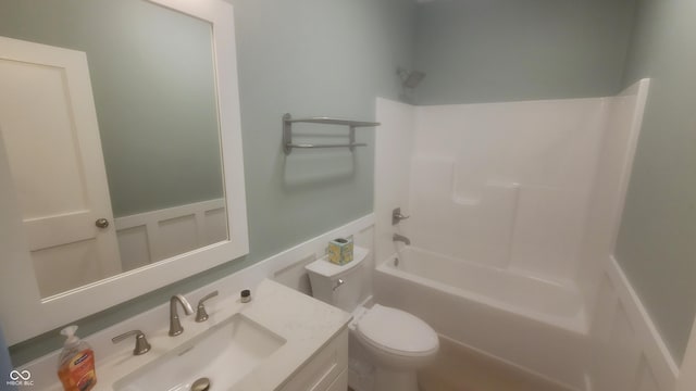 bathroom with vanity, shower / bathtub combination, and toilet