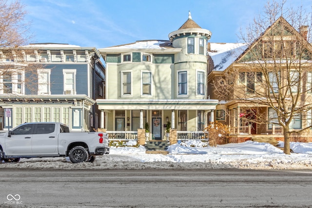 victorian-style house featuring covered porch