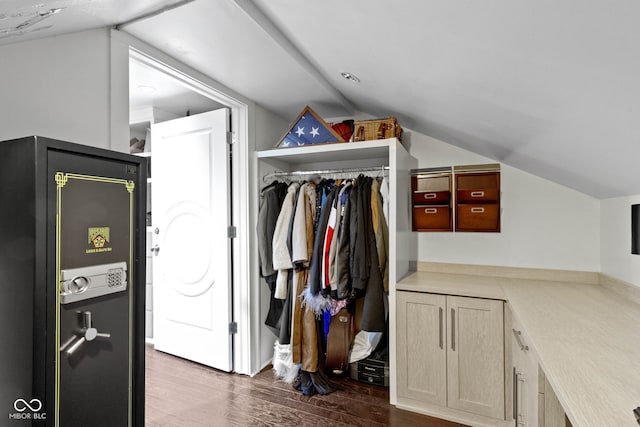 clothes washing area with laundry area and dark wood-style flooring