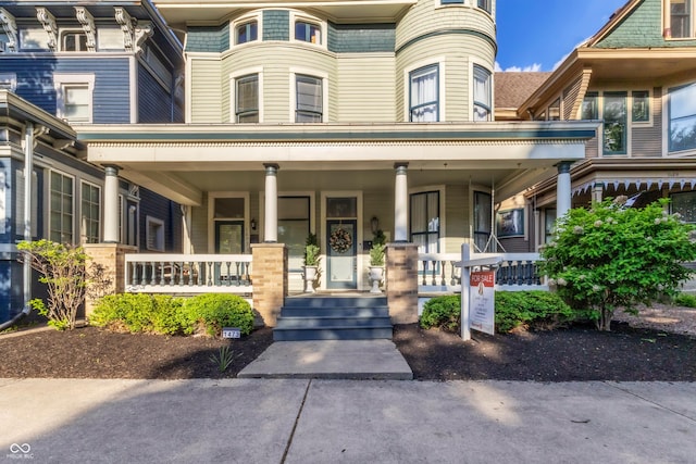 1471 N Delaware St, Indianapolis, IN 46202 - view of exterior entry with a porch