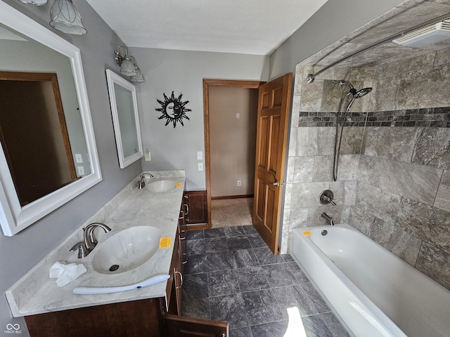 full bathroom with shower / bathtub combination, double vanity, and a sink