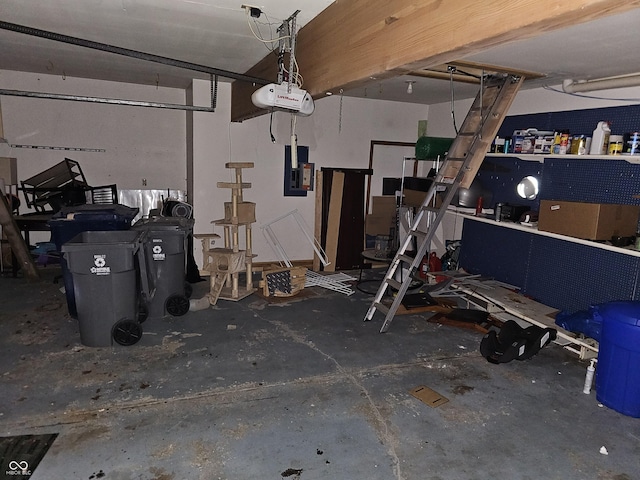 garage featuring a garage door opener and electric panel