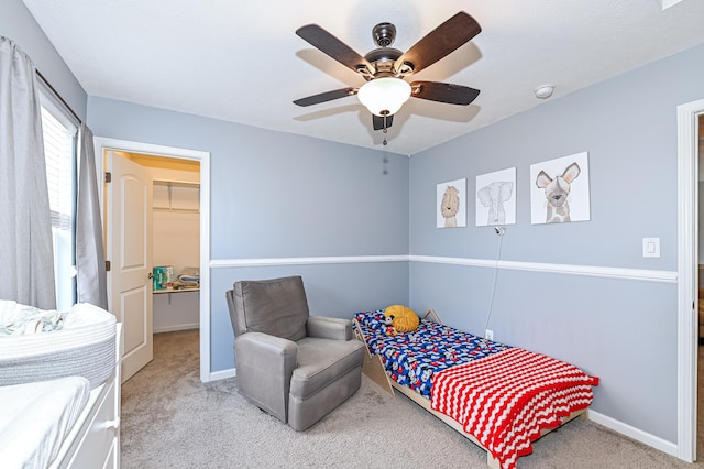 bedroom with carpet floors, a ceiling fan, and baseboards