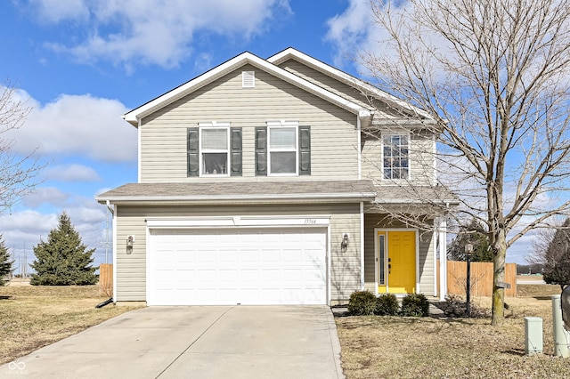 traditional home with an attached garage, a shingled roof, fence, and concrete driveway