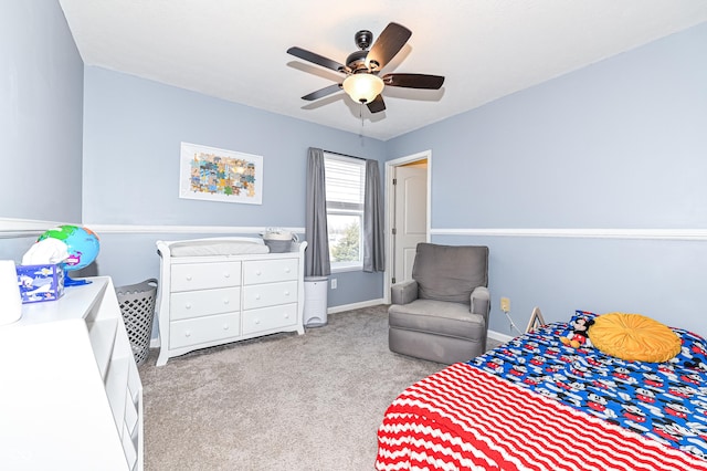 bedroom with a ceiling fan, carpet, and baseboards