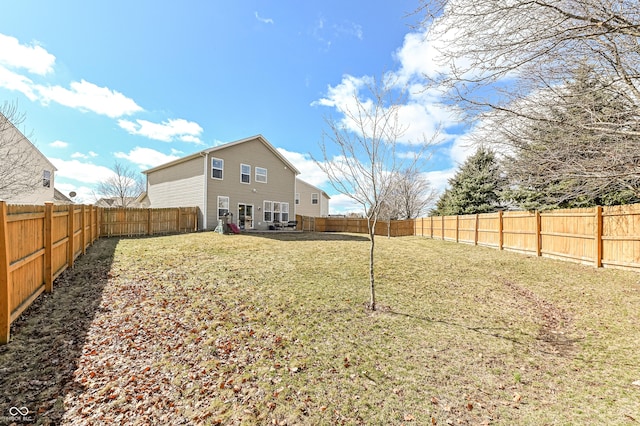 view of yard featuring a fenced backyard