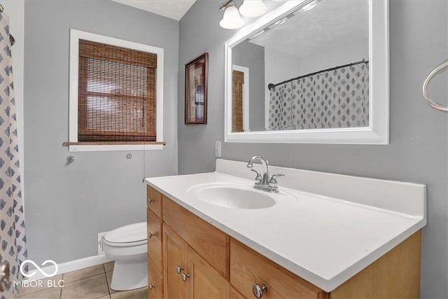 full bathroom with curtained shower, baseboards, toilet, tile patterned floors, and vanity