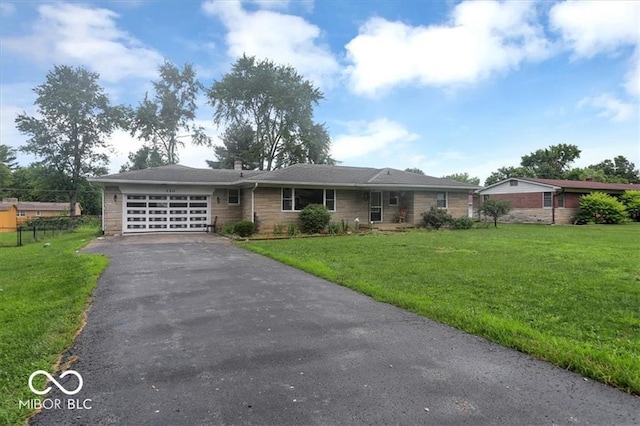 ranch-style home featuring aphalt driveway, an attached garage, a front yard, and fence