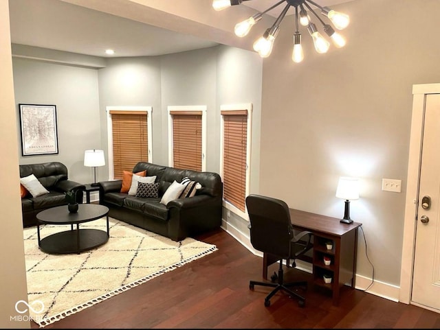 office area featuring a chandelier, dark wood-style flooring, and baseboards