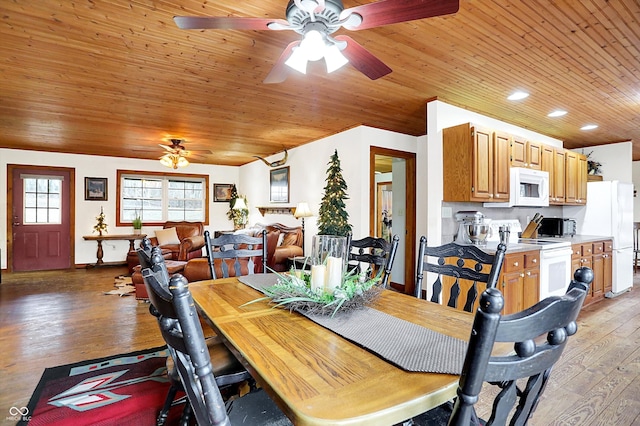 dining room featuring wood ceiling, light wood-style flooring, baseboards, and a ceiling fan