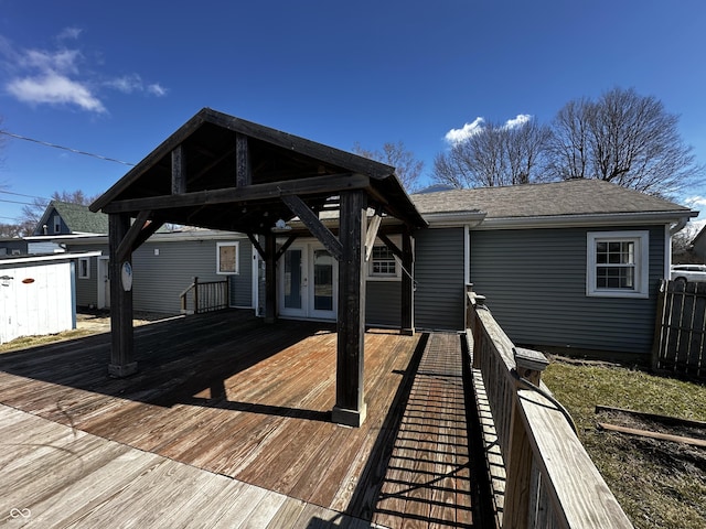 deck with french doors and a gazebo