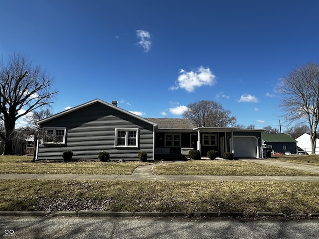 ranch-style house with a garage and driveway