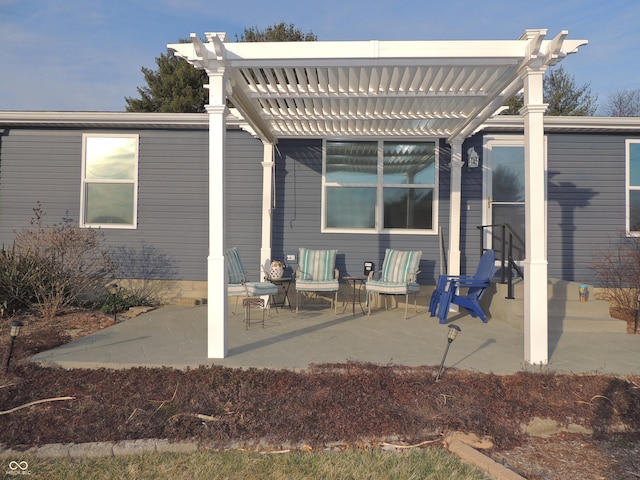 rear view of house featuring a patio and a pergola