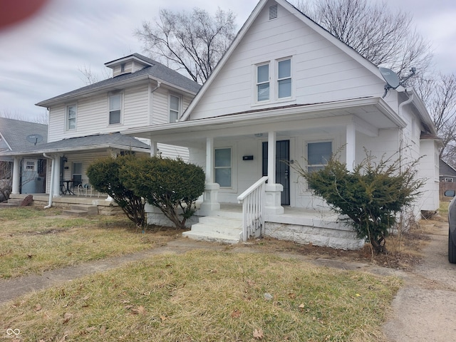 view of front facade with a porch and a front yard