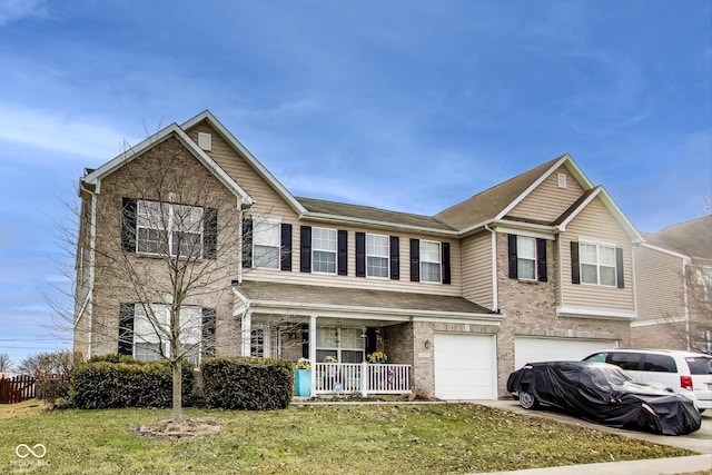 view of front of house with a porch, an attached garage, brick siding, concrete driveway, and a front yard