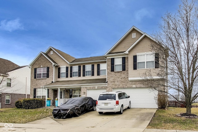 view of front of property featuring driveway, a garage, and brick siding