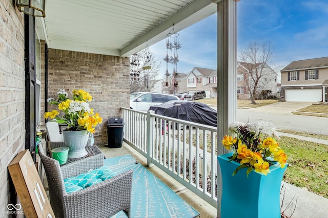 balcony featuring a residential view and a porch