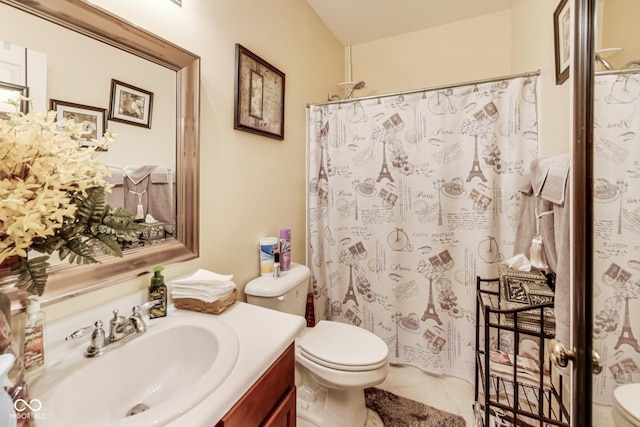 bathroom with curtained shower, vanity, and toilet