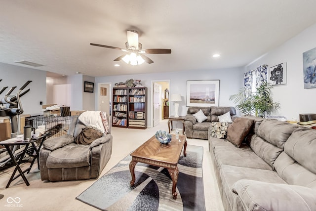 living room with ceiling fan, visible vents, carpet flooring, and recessed lighting